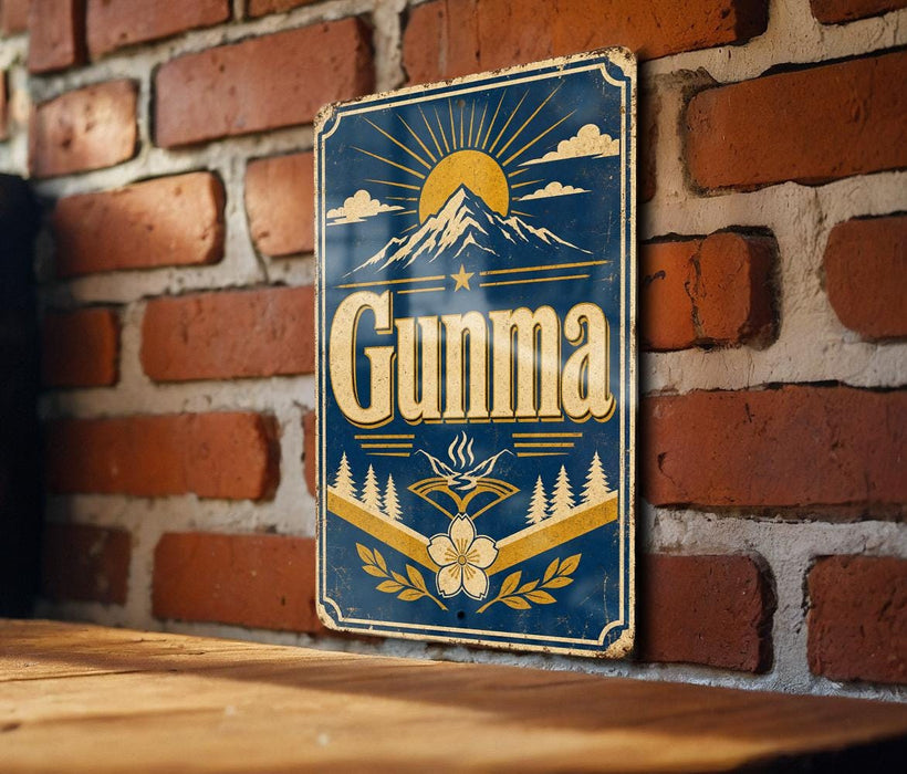 a vintage-style sign with the word "Gunna" prominently displayed, mounted on a brick wall.