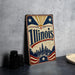 A vintage-style sign for Illinois, featuring a cityscape and stars, is displayed on a table next to some black camera lenses.