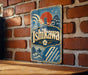 A vintage-style sign for "Ishikawa" is displayed on a brick wall, featuring a sun and pagoda design.