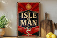 A vintage-style sign with the text "ISLE OF MAN" displayed prominently, featuring a sun and a figure in a red and black background.