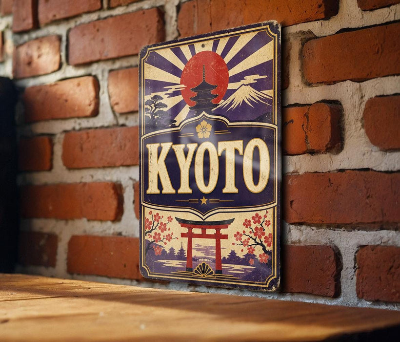 A vintage-style sign with the word "KYOTO" prominently displayed, featuring a red sun, a temple, and other traditional Japanese elements. The sign is mounted on a brick wall, and there is a wooden table in the foreground.