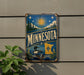 A vintage-style metal sign with the word "MINNESOTA" prominently displayed, featuring a sun, stars, and a loon.