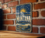 A vintage-style sign with the word "Montana" prominently displayed, featuring a sun and mountain landscape.