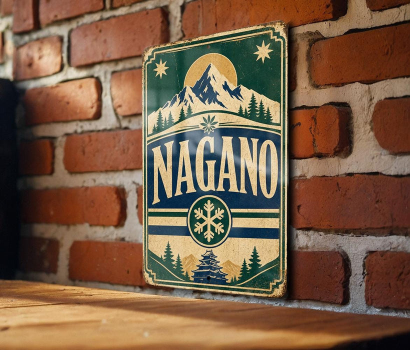 A vintage-style sign with the word "NAGANO" prominently displayed, featuring a mountain landscape and snowflake design.