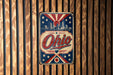 A vintage-style metal sign with the word "Ohio" prominently displayed, featuring a city skyline and stars in the background.