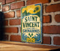 A vintage-style sign with the text "SAINT VINCENT AND THE GRIENADINES" is displayed on a brick wall.