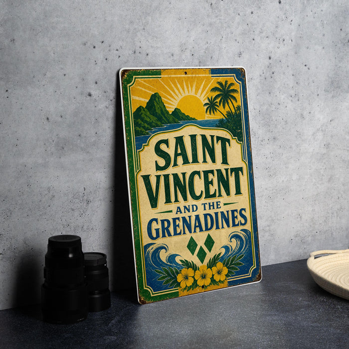A vintage-style sign for Saint Vincent and the Grenadines, featuring a tropical landscape with palm trees and mountains.
