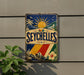 A vintage-style metal sign with a tropical beach scene and palm trees, featuring the word "SEYCHELLES" prominently displayed.