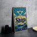 A vintage-style sign for Shiga, a Japanese beer brand, is displayed on a table next to some black camera lenses.