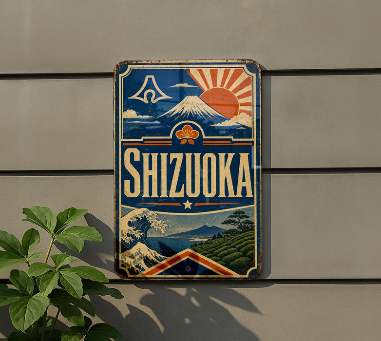 A vintage-style sign for Shizuka, a Japanese beverage, is displayed on a wall next to a plant.