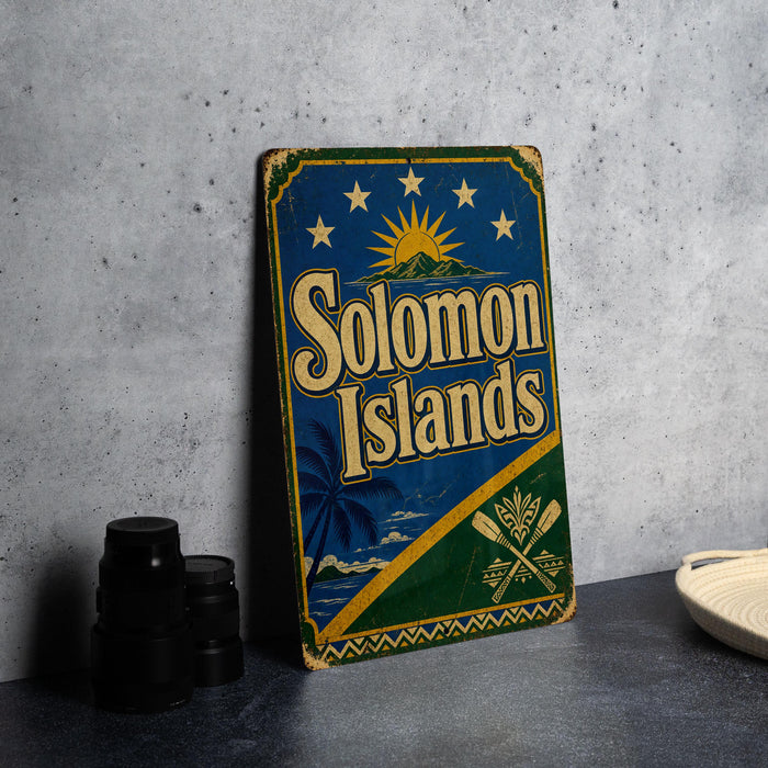 A vintage-style sign for Solomon Islands, featuring a palm tree and sun design, is displayed on a table next to some black camera lenses.