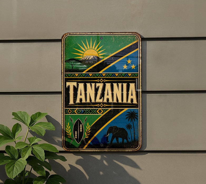 a sign with the word "Tanzania" prominently displayed, surrounded by various decorative elements such as a sun, palm trees, and a mountain.