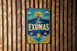 A vintage-style sign with a blue background and a sun design, mounted on a wooden wall.