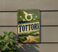 A vintage-style sign for "Tottori" is displayed on a wall, featuring a mountain landscape and a bird-like symbol.