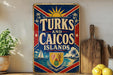A vintage-style sign that reads "TURKS AND CAICOS ISLANDS" with a sailboat, palm tree, and beach scene depicted on it. The sign is placed on a shelf next to a wooden cutting board and a potted plant.