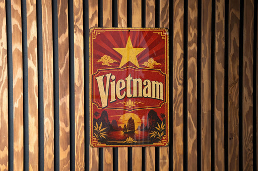 A vintage-style metal sign with the word "Vietnam" prominently displayed, featuring a red background with a yellow star and a landscape scene.