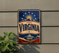 A vintage-style sign with the word "VIRGINIA" prominently displayed, featuring a sun and stars above the state name.