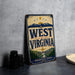 A vintage-style metal sign for West Virginia, featuring a mountain landscape and the text "WEST VIRGINIA" prominently displayed.