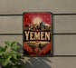 a vintage-style sign with the word "Yemen" prominently displayed, along with a cityscape and a sunburst design.