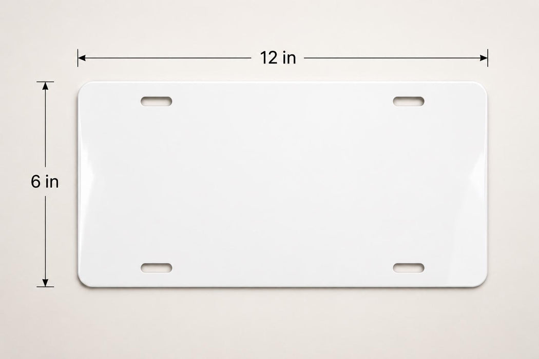 A white license plate with measurements and a scale.