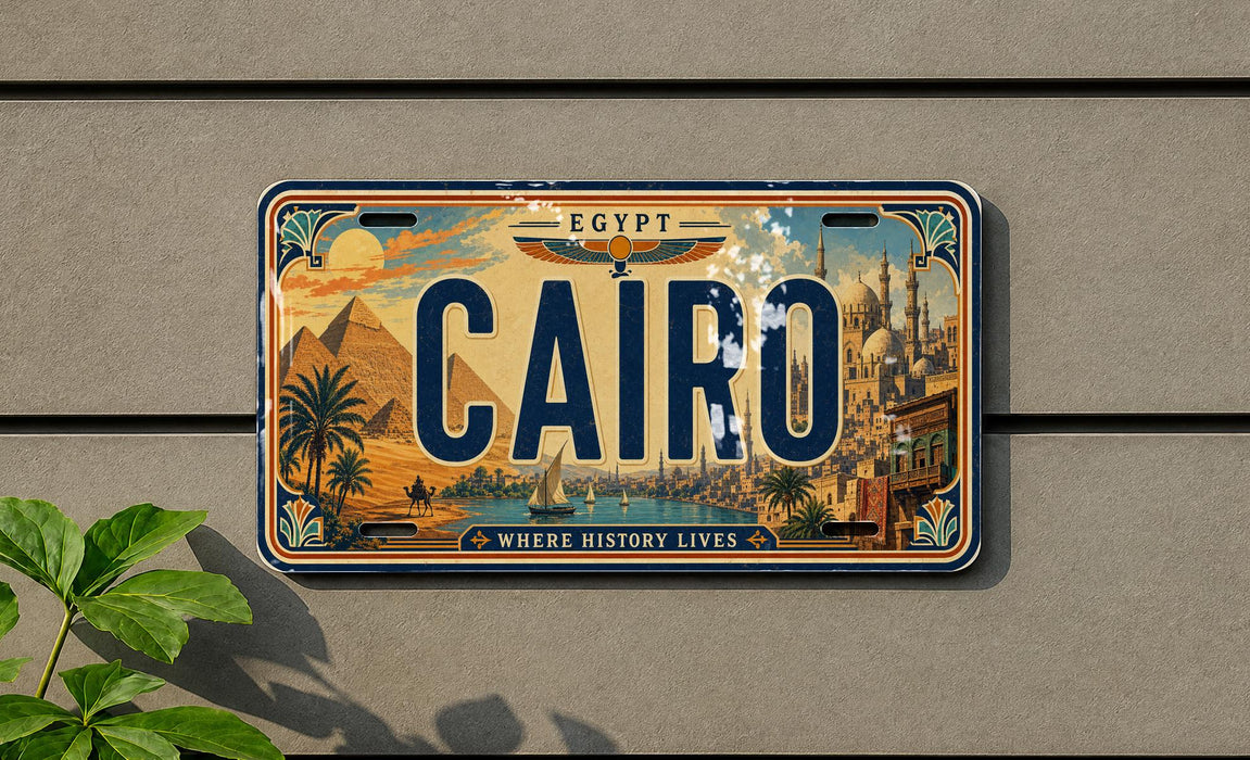 A license plate with the word "CAIRO" prominently displayed, featuring an illustration of a cityscape with landmarks such as the pyramids of Giza.