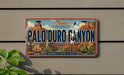 A vintage license plate from Texas, featuring the name "Palo Duro Canyon" and the state's motto "The Grand Canyon of Texas".