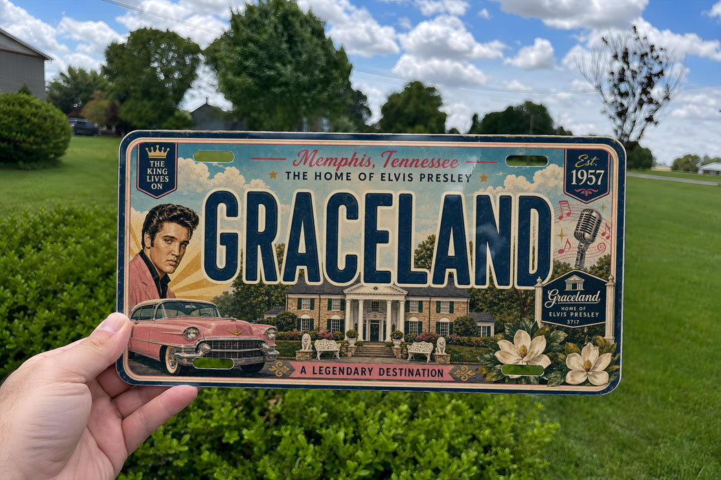 A person is holding a vintage license plate that features an illustration of a classic car and a house, along with the text "Graceland" and "The Home of Elvis Presley".