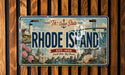 The image is a vintage license plate from Rhode Island that features various landmarks and scenery, including a lighthouse, a bridge, and a city skyline.