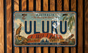 A vintage license plate from Australia with the word "ULURU" prominently displayed.
