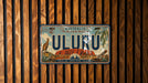 A vintage license plate from Australia, featuring the word "ULURU" and an illustration of Uluru, the iconic red rock formation in the Northern Territory of the Northern Territory.