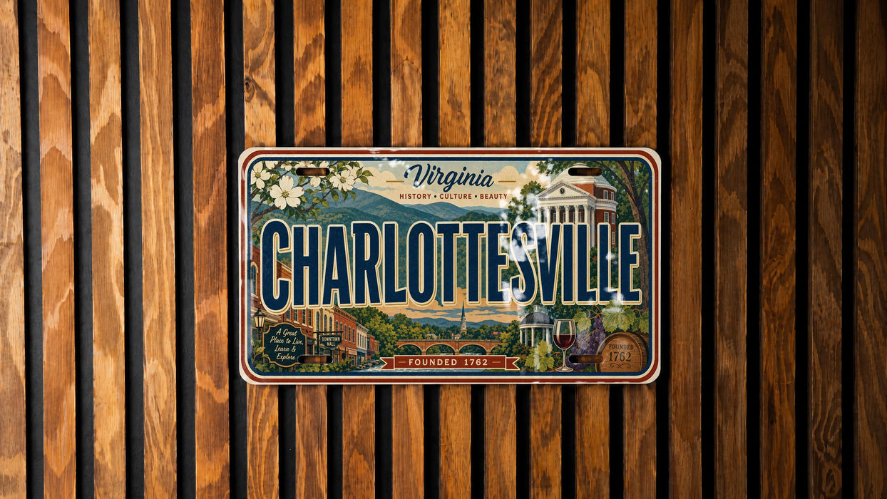 A vintage Virginia license plate with the text "CHARLOTTE'SVILLE" and "FOUNDED 1792" displayed on a wooden background.