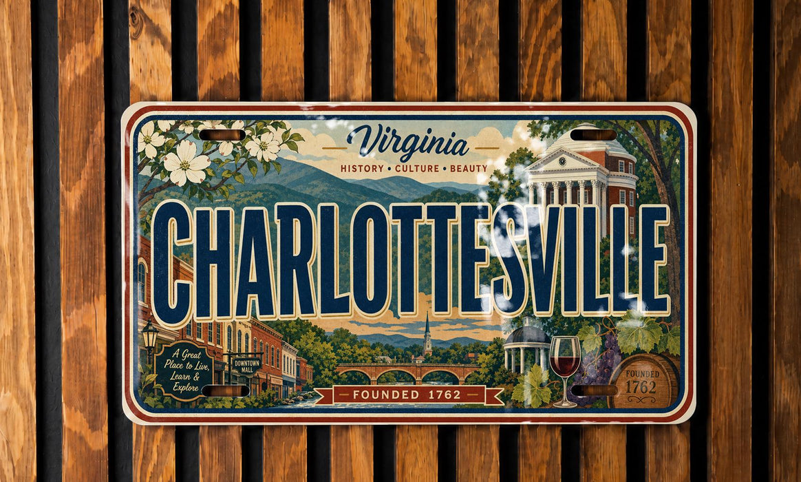 A Virginia license plate with the text "CHARLOTTE'SVILLE" and an illustration of a cityscape with buildings, trees, and a bridge.