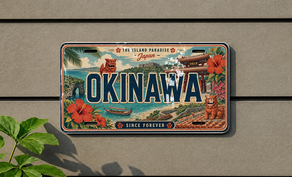 a decorative license plate with the text "OKINAWA" prominently displayed, surrounded by various Japanese-themed illustrations such as a temple, flowers, and a boat.