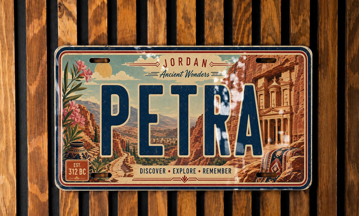 A vintage license plate with the word "PETRA" prominently displayed, featuring an illustration of a desert landscape with a building in the background.