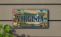 A decorative license plate from Virginia, featuring a scenic illustration of the state's landmarks and natural beauty.