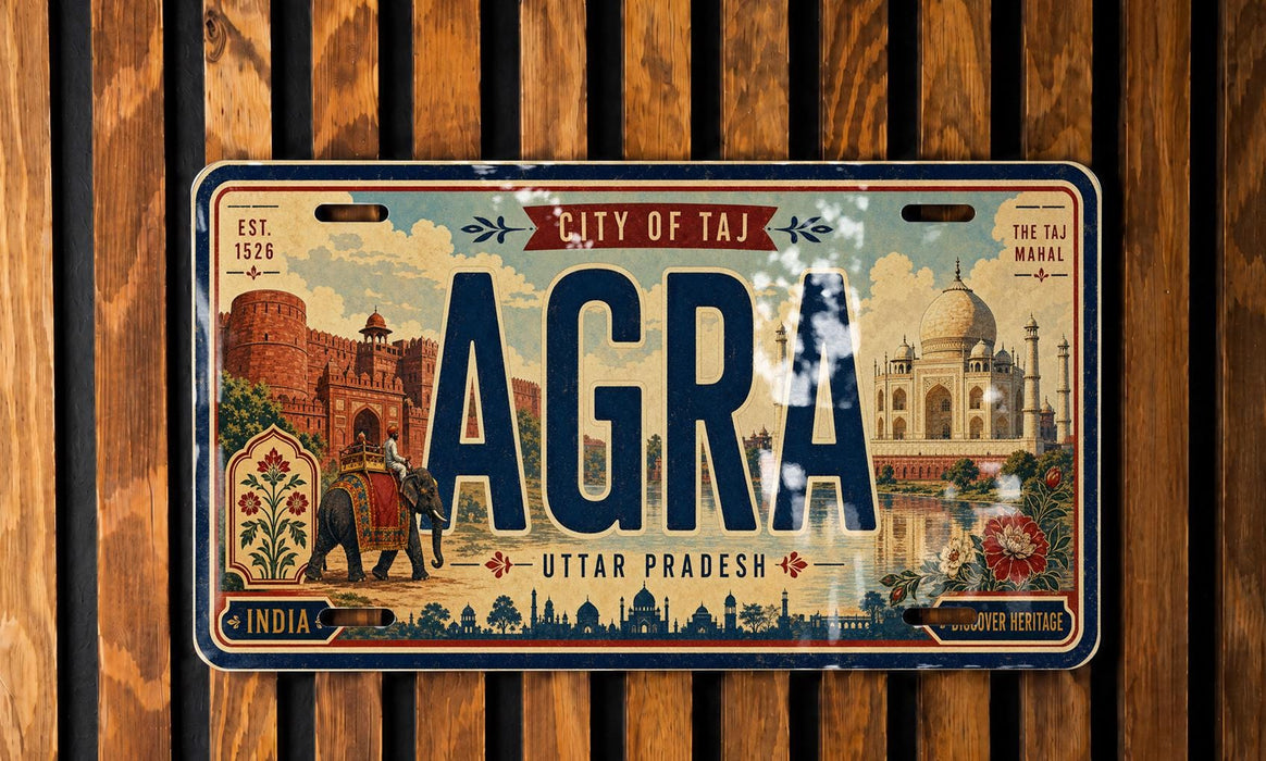 The image is a vintage license plate from India that features the name "AGRA" prominently in the center, with the city of Agra, India, and the state of Uttar Pradesh, India, displayed below. The plate also includes the text "THE TAI MANAL" and "DISCOVER HERITAGE" along the bottom edge.