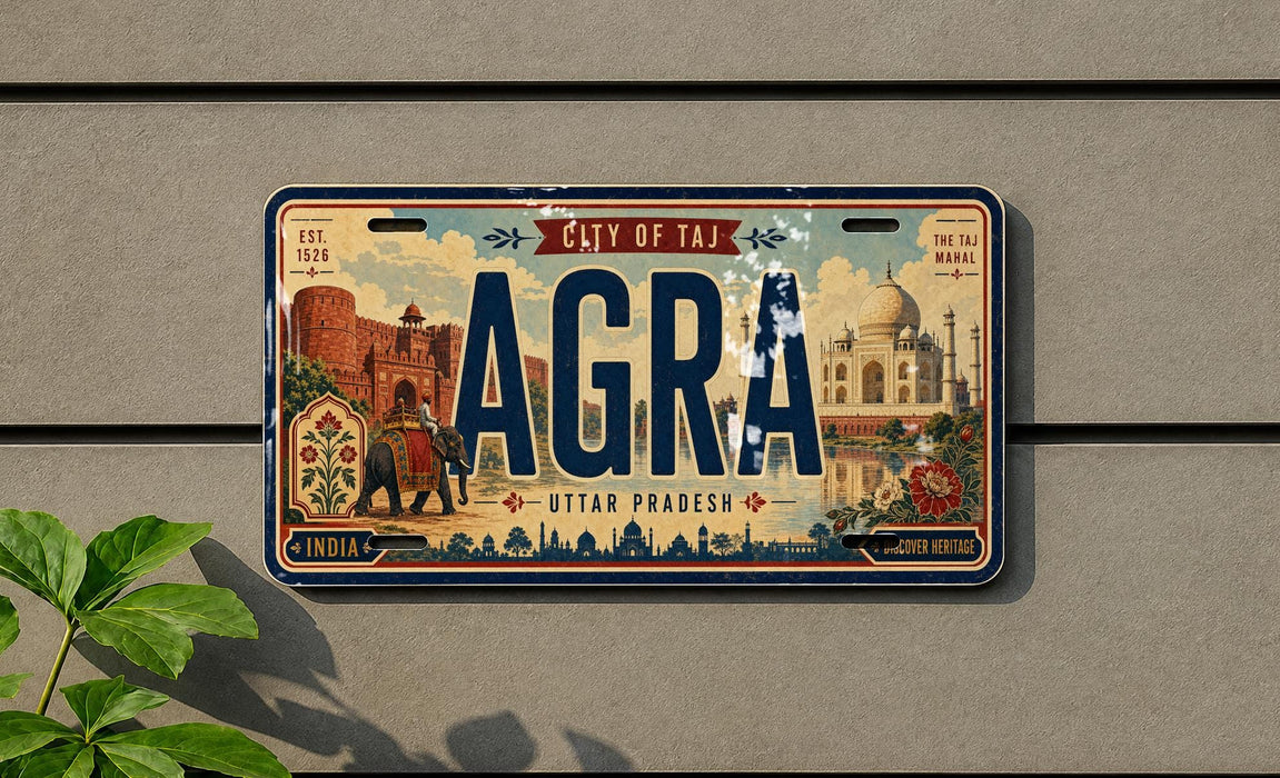 The image is a license plate from India that reads "AGRA" and features a design of the Taj Mahal and other iconic landmarks.