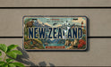 a decorative license plate with a vintage design, depicting a scenic landscape of New Zealand.