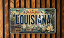 A vintage license plate from Louisiana featuring an illustration of the state's landmarks and scenery.