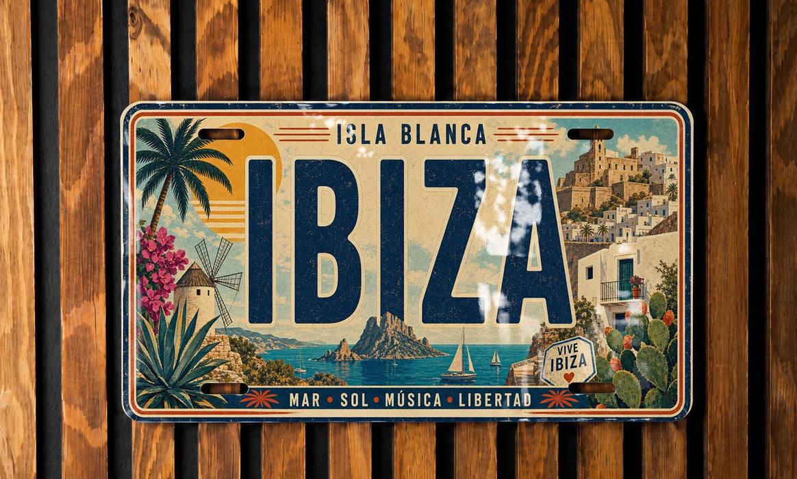 A vintage license plate from the island of Ibiza, featuring a tropical landscape with palm trees, cacti, and other scenic elements.
