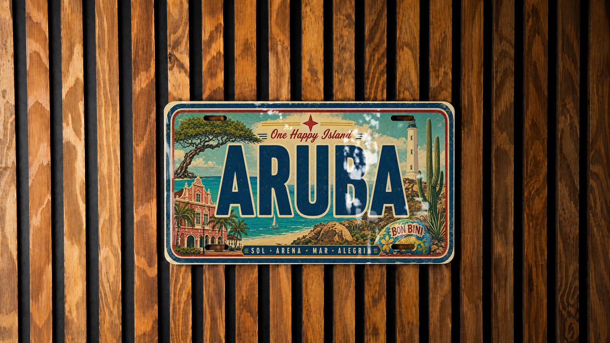 A vintage license plate from Aruba, featuring a tropical island landscape with palm trees, a lighthouse, and a beach.