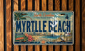 A vintage license plate from South Carolina, featuring the name "Myrtle Beach" and various beach-related imagery.