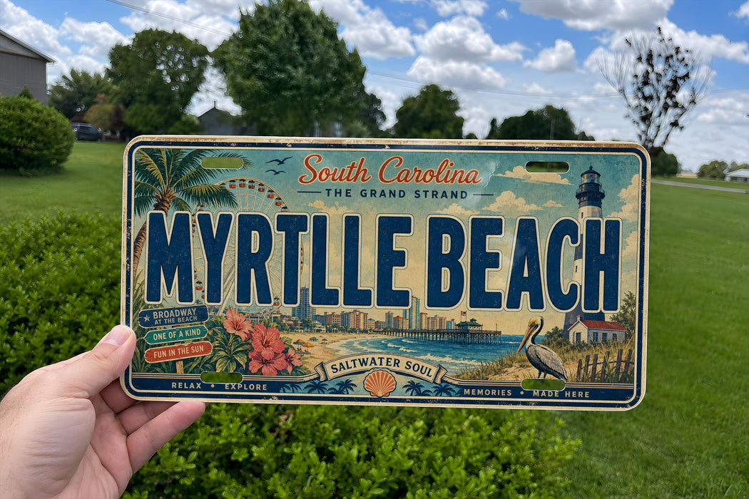 A person is holding a license plate that says "MYRTILLE BEACH" with a scenic beach and lighthouse image on it.