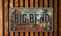 A vintage license plate with the text "BIG BEND" and "Wild & Timeless" printed on it, indicating it is from the Big Bend National Park.
