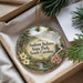 A decorative ornament with a scenic landscape of Andrew Jackson State Park, South Carolina, hanging from a string.