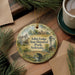 A decorative ornament featuring a scenic image of the Arbor Lodge State Historical Park in Nebraska, with a bridge and other natural elements.