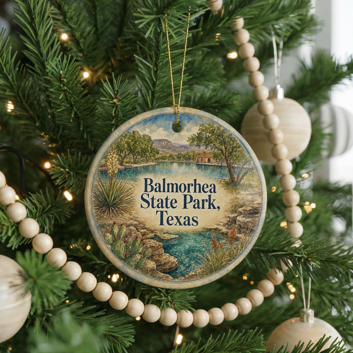A circular ornament hanging on a Christmas tree, featuring a scenic landscape of Balmorheeta State Park, Texas.