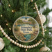 A circular ornament hanging on a Christmas tree, featuring a scenic landscape of Balmorheeta State Park, Texas.