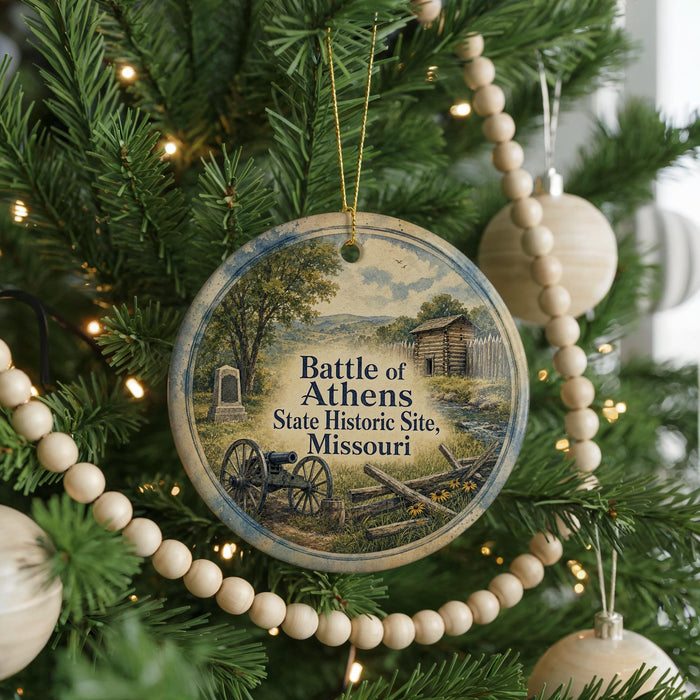 A round ornament on a Christmas tree, featuring a scene of a battle in the Battle of Athens, Missouri.