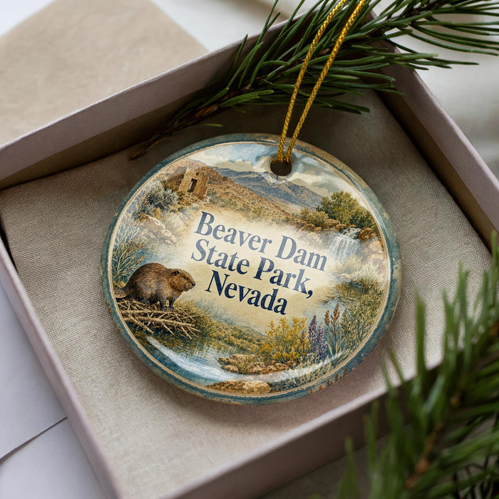 A decorative ornament in a box, featuring a beaver and the text "Beaver Dam State Park, Nevada".